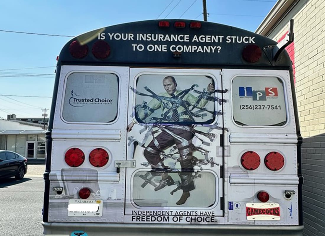 About Our Agency - Rear View of a Bus With the Agency's Logo on it