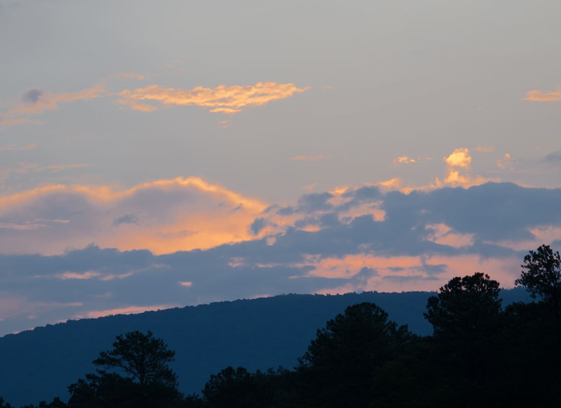 Anniston, AL - Predawn Sun Illuminates the Clouds Over the Hills Near Anniston, Alabama